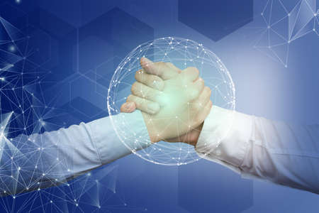 Hands shaking symbolizing globalization presenting innovative successful teamwork. Greeting palms...