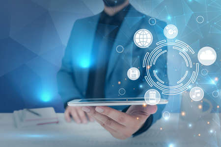Businessman in suit holding tablet symbolizing successful teamwork accomplishing newest project...