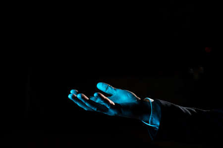 Hand Holding Important Informations. Palm Pointing Crutial Announcements. Businessman Presenting Recent Updates. Executive Showing Late Achievements.の写真素材