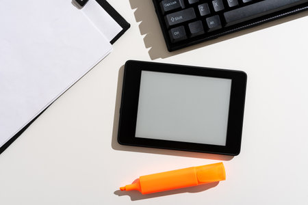 Important Message Presented On Tablet On Desk With Keyboard, Paper And Marker. Crutial Information Shown On Cellphone Screen Placed On Table. New Ideas On Mobile Phone.の写真素材