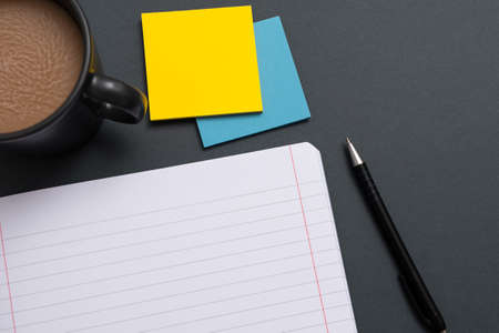 Notebook With Important Message On Desk With Coffee, Pen And Notes. Crutial Information On Pad On...