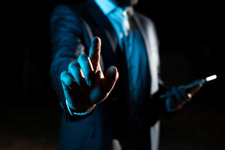 With One Finger Pointing Important Infortmations With Other Hand Holding Tablet. Businessman Showing...