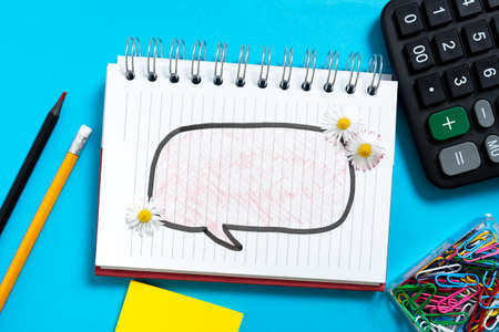 Speech Bubble With Recent Updates With Flowers Around Written On Notebook On Desk With Office...