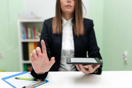 Businesswoman Holding Marker With One Hand And Pointing Important Ideas. Woman With Colored Pen...