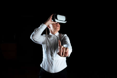 Female Professional Wearing Virtual Reality Headset Gesturing And Enjoying Simulator. Elegant...