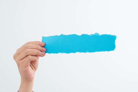 Businesswoman Holding Piece Of Paper With Important Messages With One Hand. Woman Presenting Crutial...