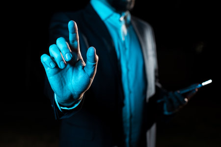 With One Finger Pointing Important Infortmations With Other Hand Holding Tablet. Businessman Showing Recent Updates. Executive Displaying Critical Messages.の写真素材