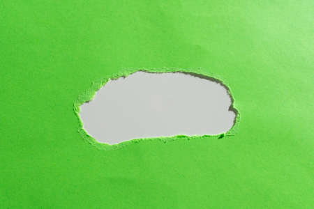 Important Information Written Under Ripped Piece Of Paper. Crutial Announcement Underneath Torn Notepaper. Critical Data Shown Beneath Teared Apart Worksheet.の写真素材