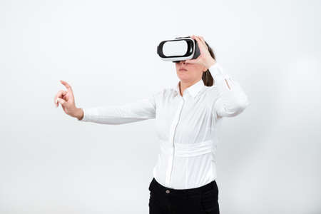 Woman Wearing Vr Glasses And Pointing On Important Messages With One Finger. Businesswoman Having...