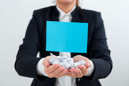 Businesswoman Holding Paper Wraps And Important Message On Stick. Woman Having Crumpled Notes And...