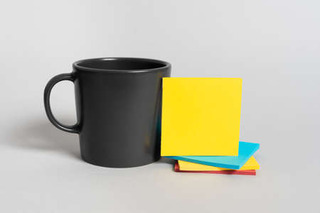 Cup And Pile Of Sticky Notes With Important Information On Desk. Mug And Crutial Message On Paper On...