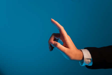 One Finger Pointing Important Infortmations. Hand Presenting Crutial Announcement. Woman Showing Recent Updates. Executive Displaying Critical Messages.の写真素材