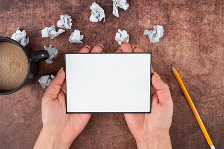 Hands Of Woman Holding Blank Sheet With Pencil, Coffee Cup And Crumpled Papers Over Wooden Background. Businesswoman With Empty Copy Space For Advertising The Business.の写真素材