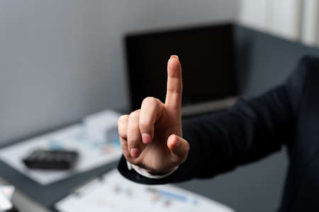 Businesswoman Pointing Important Infortmations With One Finger. Hand Presenting Crutial...