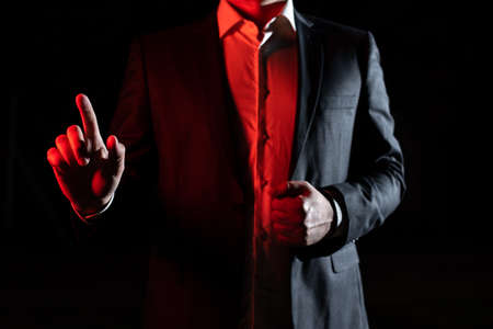 Businessman Pointing With One Finger On Important Message. Executive In Suit Presenting Crutial Information. Gentleman Showing Critical Announcement.の写真素材
