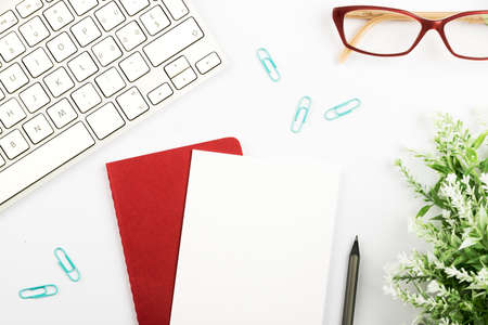 Important Announcements On Piece Of Paper Over Notepad On Desk With Flower, Glasses, Pen, Hot Drink...
