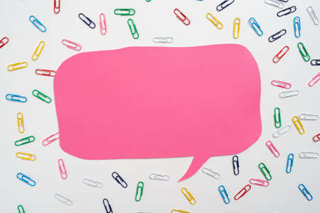 Colorful Paperclips Placed Around Speech Bubble With Important Information. Colored Clips Arranged All Over Dialogue Balloon With Crutial Announcement.の写真素材