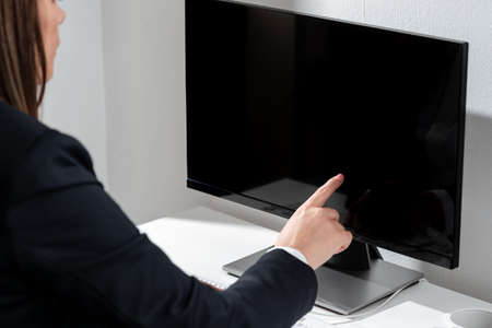 Businesswoman Pointing Important Infortmation With One Finger On Computer. Hand Presenting Crutial...