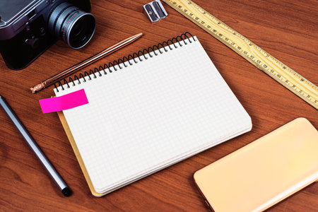 Important Message Presented On Notebook On Desk With Vintage Camera, Cellphone, Ruler And Sharpener. Crutial Informations On Notepad On Table With Mobile Phone.の写真素材