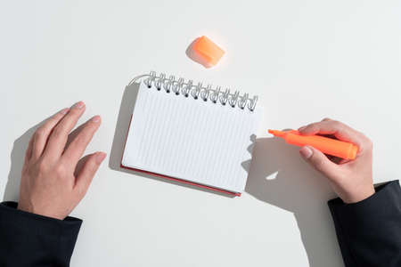 Businesswoman Writing Important Message On Notebook With Marker On Desk. Woman Presenting Crutial...
