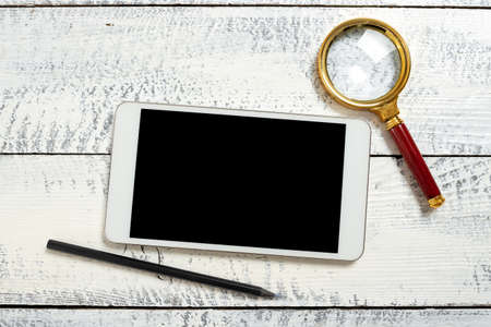 Tablet With Important Messages With Magnifier And Pencil Around. Cellphone Screen With Crutial Ideas...