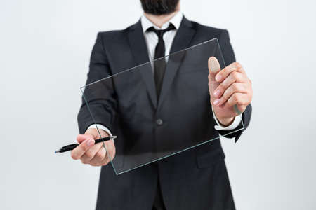 Male Corporate Holding Pen And Transparent Glass And Presenting Important Information. Businessman...
