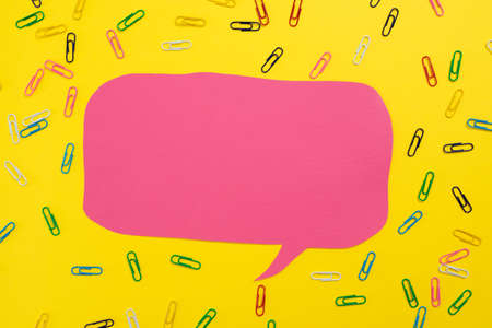 Colorful Paperclips Placed Around Speech Bubble With Important Information. Colored Clips Arranged All Over Dialogue Balloon With Crutial Announcement.の写真素材