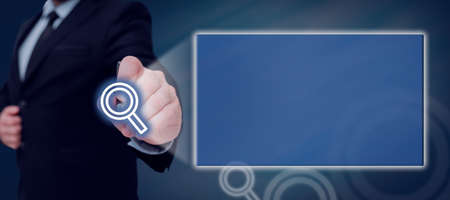 Businessman Holding A Tablet And Projecting A Camera In A Graphic Hexagone Design. Man In A Necktie...