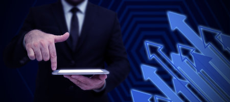 Businessman in suit holding tablet symbolizing successful teamwork accomplishing newest project...