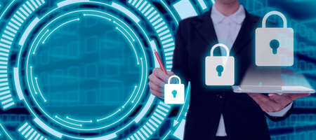 Businesswoman With A Tablet And Pen Pointing On Security For Data And Messages In An Abstract...