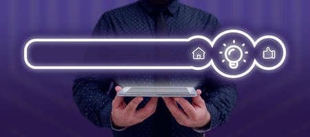 Businessman Holding A Tablet With Glowing Light Bulb And Other Digital Signs In A Graphic Design....
