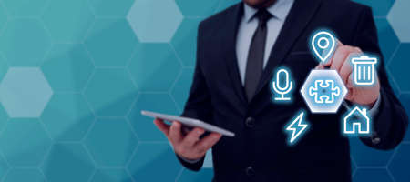 Businessman Holding Tablet And Pen Pointing On S And Presenting Important Informations. Man In Suit...