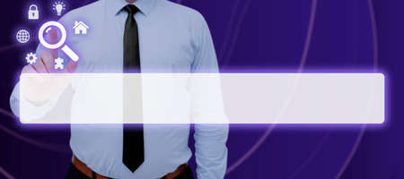 Businessman Pointing On Digital Symbols And Search Bar Looking For Data In An Abstract Design. Man Standing And Checking Important Information And Concepts.の写真素材