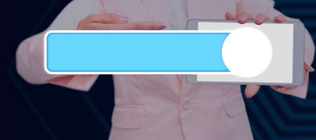 Businessman Holding A Tablet And Pointing On A Glowing Slider Symbol In A Futuristic Design. A Hand Opening A Digital Device With Crucial Information And Messages.の写真素材