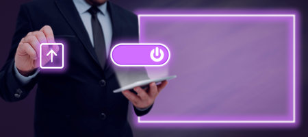 Businessman Showing A Power Button On A Tablet And Pen Pointing On Upload In A Futuristic Design. Man With Pen And Pad On Hand Uploading Important Files And Data.の写真素材