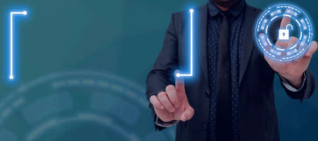 Businessman Pointing With Two Fingers On Futuristic Design With Padlock And Presenting New Ideas....