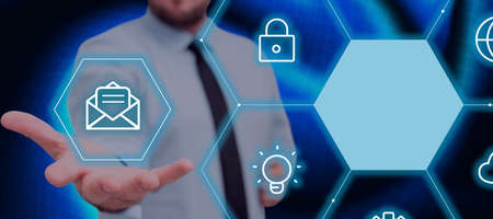 Businessman Extending Hand And Showing Digital Symbols And Mail Envelope In A Futuristic Hive...