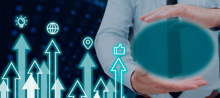 Businessman With Digitally Generated Oval Shape In Hands By Graphical Arrows Moving Up With Multiple...