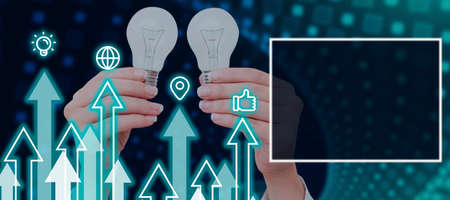 Hands Of Businesswoman Showing Light Bulbs With Graphical S And Arrows Moving Up By Blank Display....