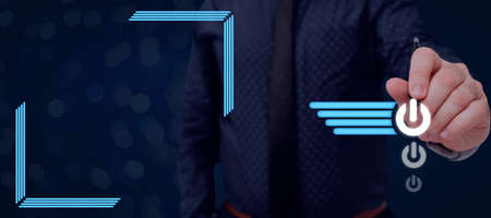 Businessman Holding A Pen And Pointing On Multiple Power Button Symbols With Futuristic Design. Manager In A Necktie Having A Pen On Hand Presenting Data And Ideas.の写真素材