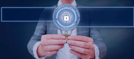 Businesswoman Holding A Light Bulb With Two Hands In A Graphic Hexagon Design. Woman Displaying...