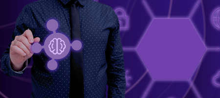 Businessman Standing And With Hand Pointing On Artificial Intelligence Symbol In Futuristic Design....