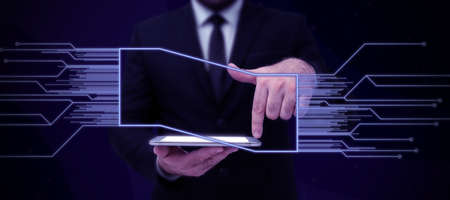 Businessman in suit holding tablet symbolizing successful teamwork accomplishing newest project...