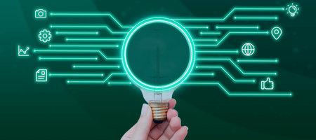 Businesswoman Hand Holding Bulb Showing Digitally Generated Lines And Different S. Woman With Light...