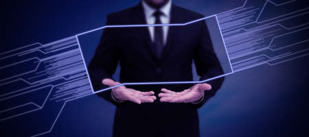 Businessman in suit holding tablet symbolizing successful teamwork accomplishing newest project...