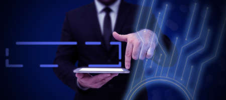 Businessman in suit holding open palm symbolizing successful teamwork accomplishing newest project plans. Man reaching hand out representing combined effort management.の写真素材