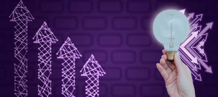 Businesswoman Hand Holding Light Bulb Showing Business Data By Arrows Moving Up And Network With A...