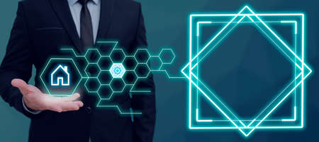 Businessman Presenting Over Hand And Showing Important Messages. Man In Suit Displaying Pattern With Symbols Above Palm And Crutial Informations On Side.の写真素材