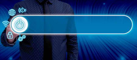 Businessman With A Pen Pointing On The Power And Digital Symbols In A Futuristic Design. Man With...
