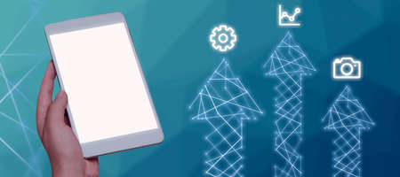 A Hand Holding A Tablet And Displaying Arrows Going Up With Digital S On Them In A Futuristic Design. A Person Receiving Important Information And Messages.の写真素材